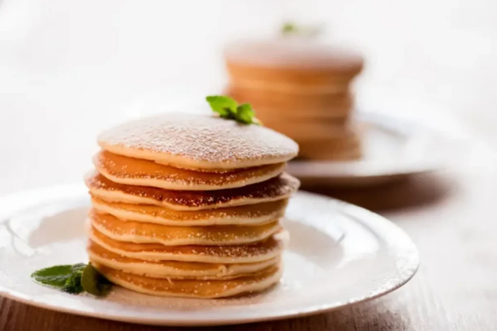 depositphotos 147564025 stock photo pancakes with mint and powdered