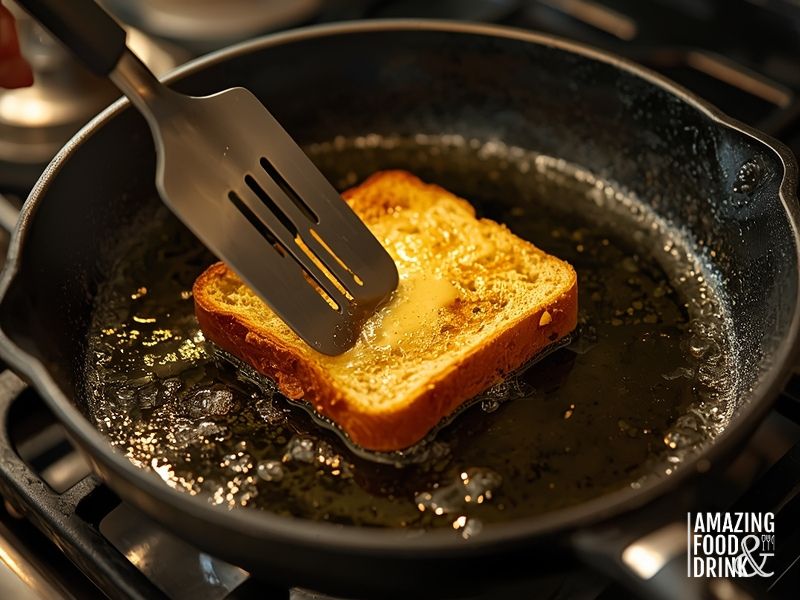 Pan-frying bread in butter to create crispy toast for toasted bread with eggs